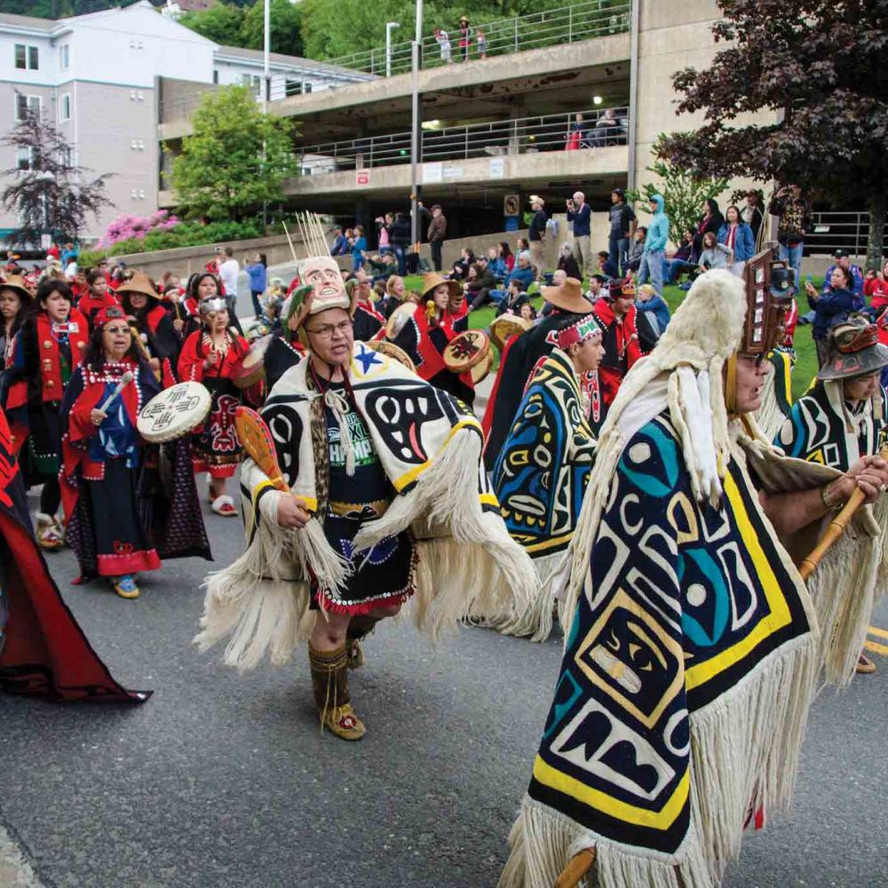The Cape Fox Dancers in colorful traditional gard and headwear at the Sealaska Heritage Institute Celebration in 2014. 