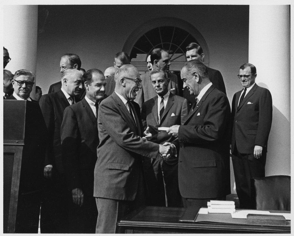 West Virginia Congressman Ken Hechler shakes hands with President Lyndon Johnson