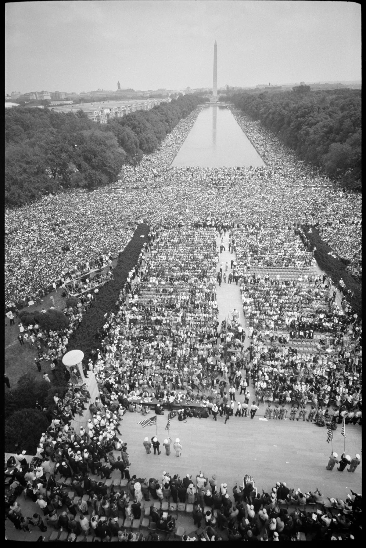 black and white photograph of view down the national mall, large crowd of people