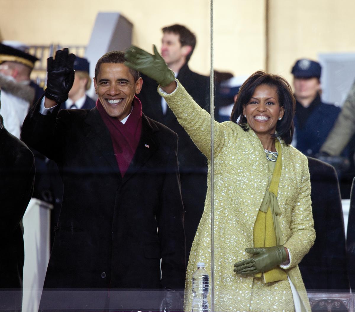 colored photo of Barack Obama and Michelle Obama waving