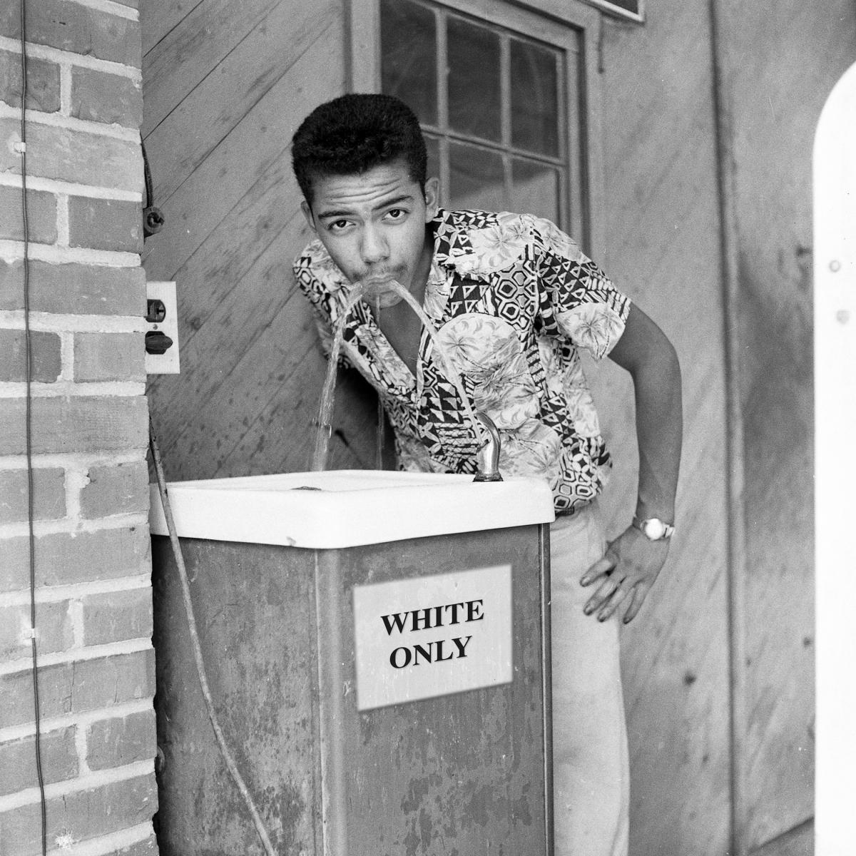 Water fountain with "white only" sign in 1956