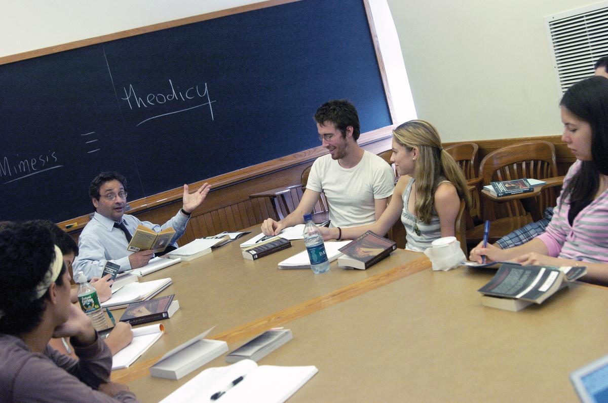 Andrew Delbanco teaching at a classroom table
