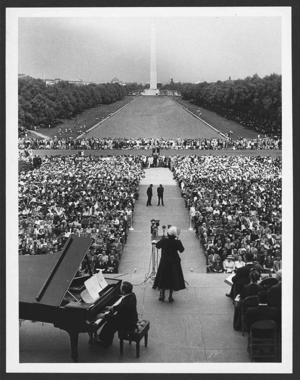 Marian Anderson sings to an audience at the Lincoln Memorial in 1952. The Washington Monument and reflecting pool is in the background.