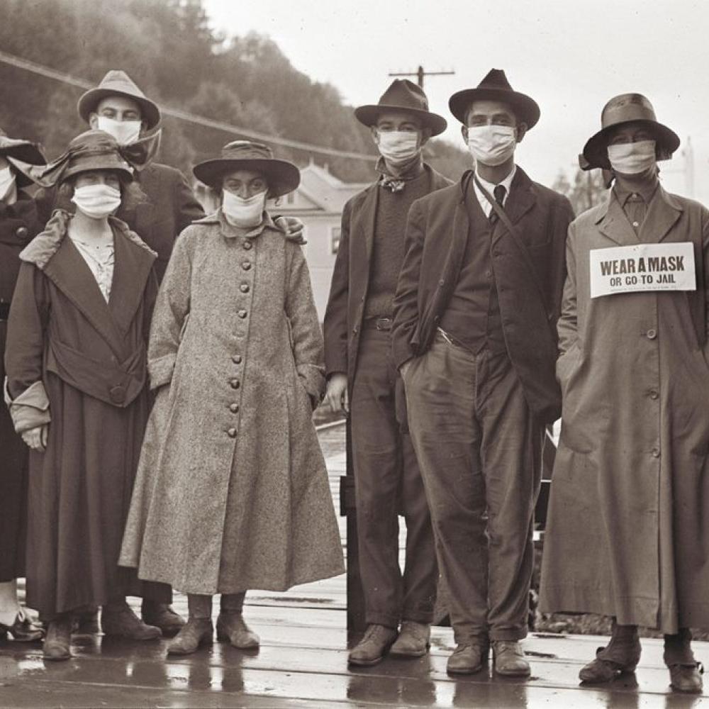 A vintage photo presumed to have been taken during the 1918 influenza pandemic, when face masks were as iconic as they are today.