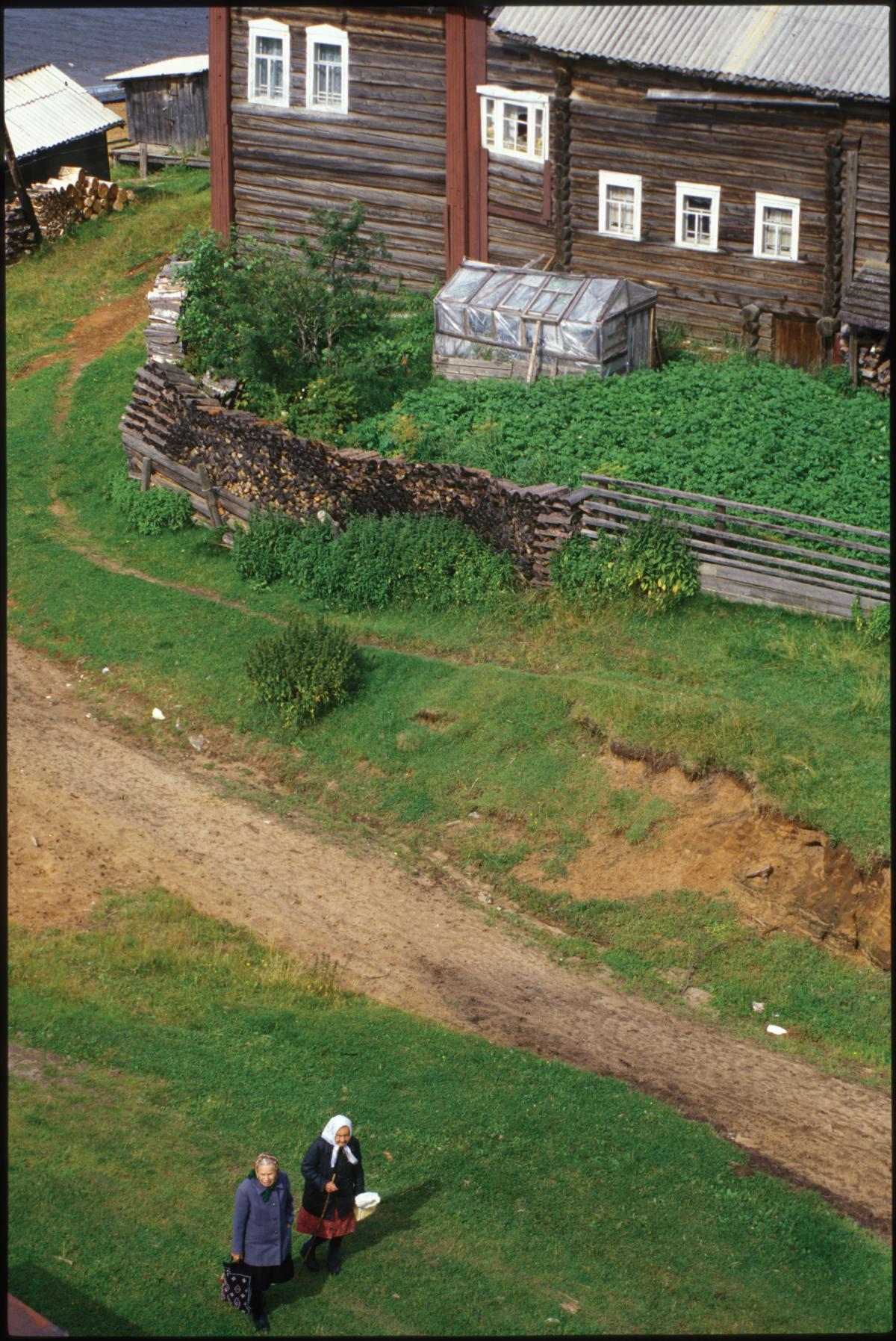 photograph looking down at a wooden fence