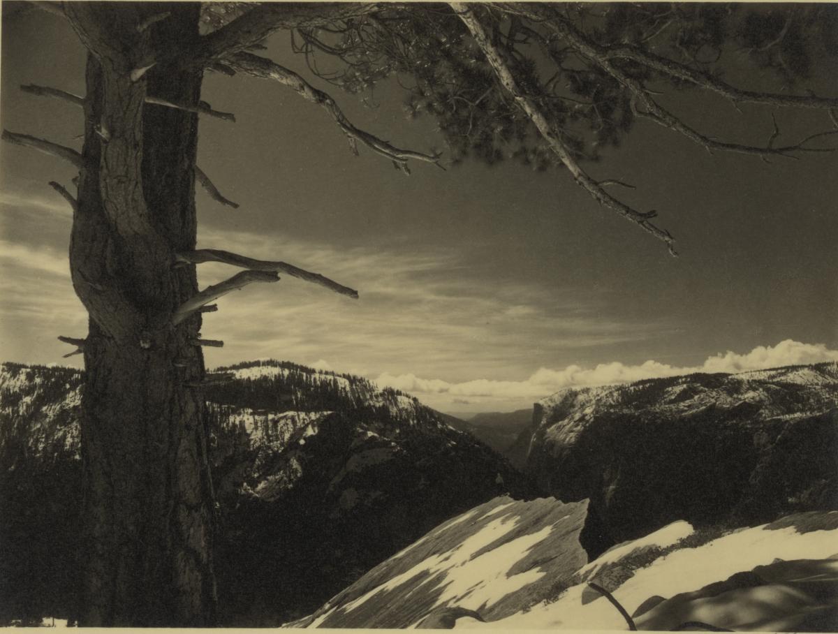 Yosemite Valley as seen from a high mountain vantage point, under a cloudless sky