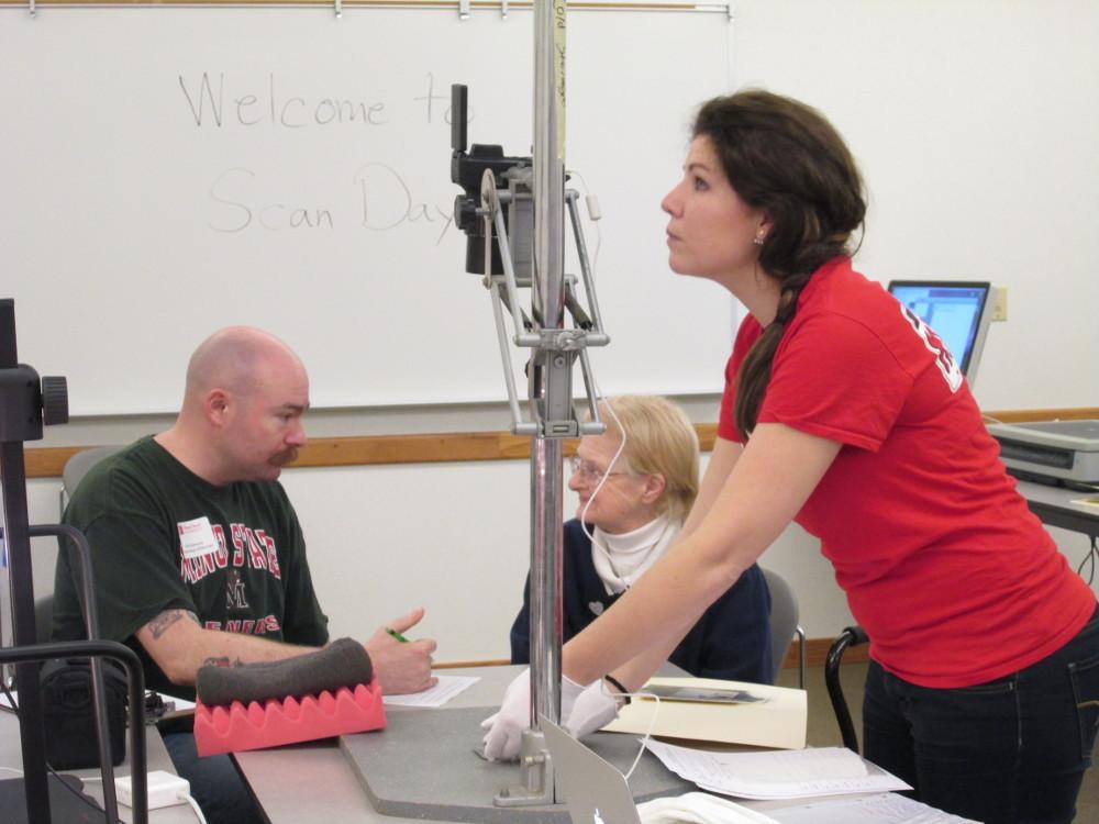 Volunteer “digital ambassadors” and attendees at Minot State History Scan Day