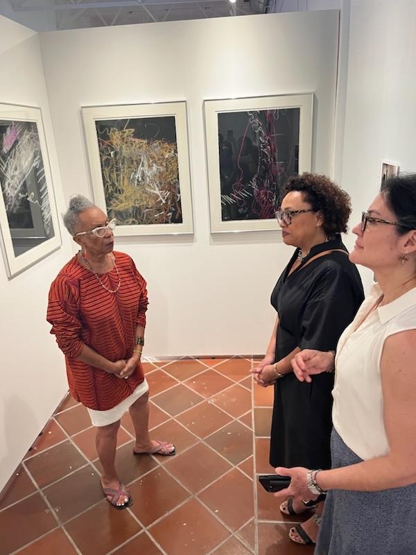 NEH Chair Lowe and NEA Chair Jackson tour Muesta Legado at the ICP headquarters with Awilda Sterling Duprey.