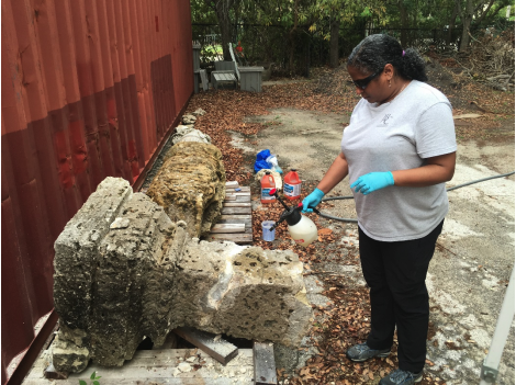 Helen Thomas-Haney, conservator with Jablonski Building Conservation Inc., preparing base fragment for re-assembly of the Calder Herm, in March 2019.