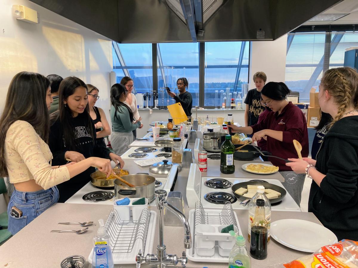 Students cooking together in a Virginia Tech kitchen.