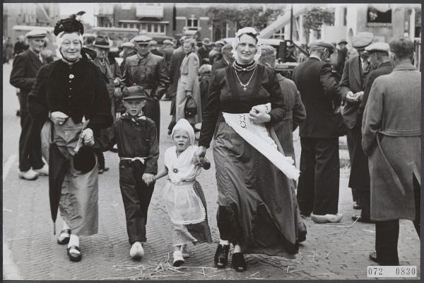 Women and children dressed in folklore costumes.