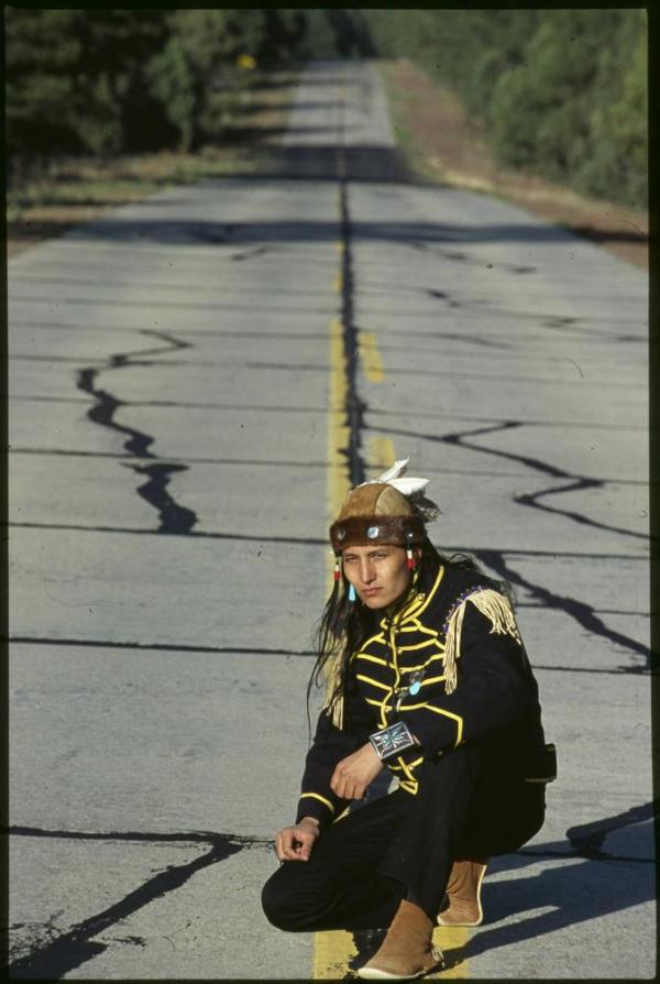 Man kneeling on route 66