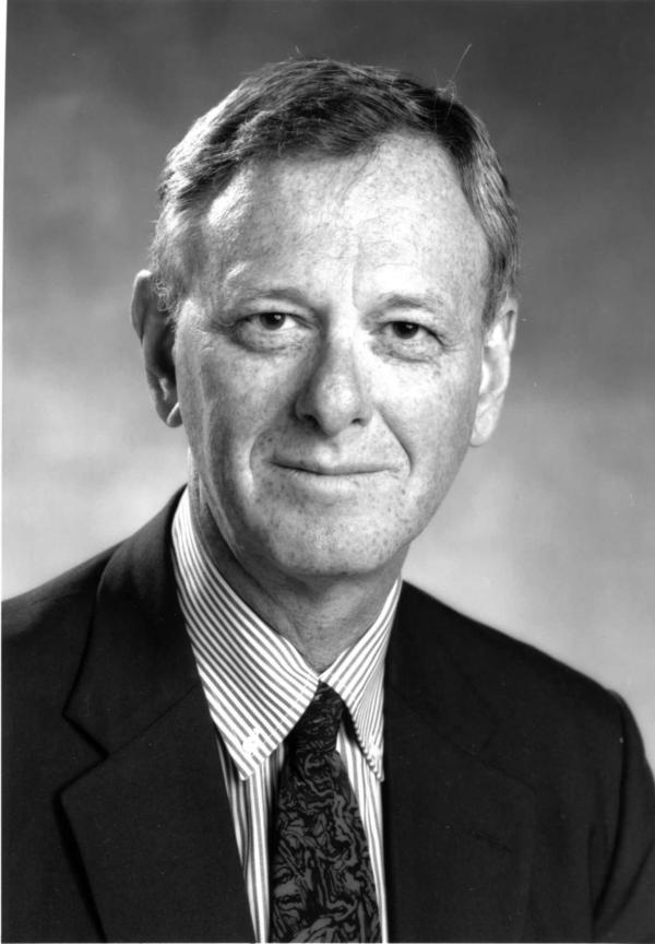 Black and white portrait of Urofsky in a dark suit and tie