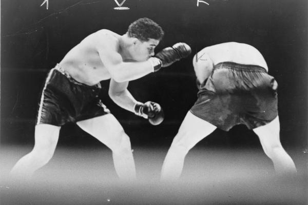 Joe Louis looks for an opening during a boxing match with Max Schmeling, 1936