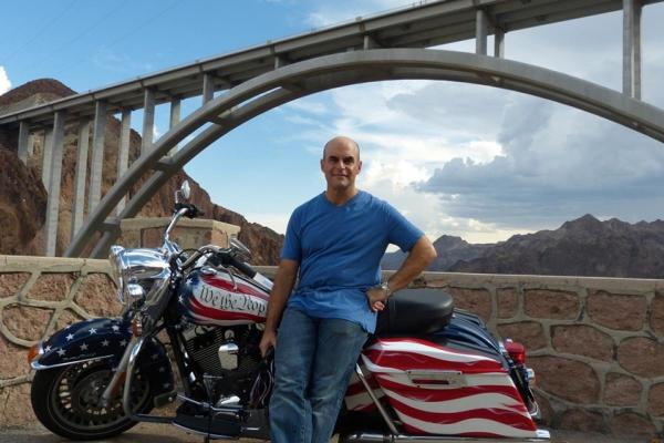 Peter Sagal with motorcycle: Constitution USA