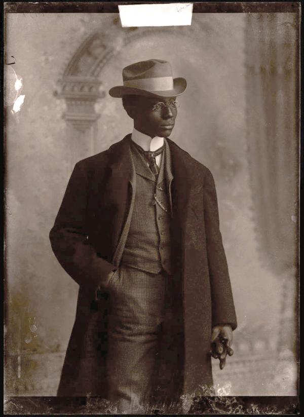 Studio portait, three-quarters length, of the lawyer Franklin in stylish hat and overcoat