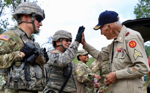 WWII Veteran and RI National Guard member high-five