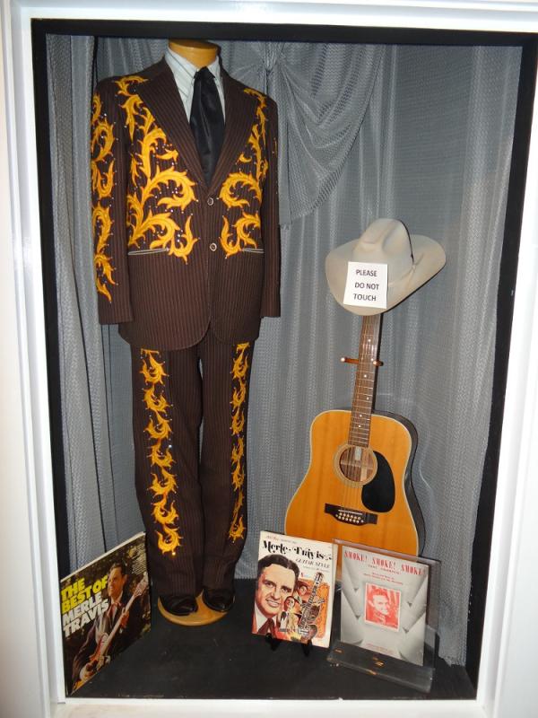 Suit and guitar of country musician Merle Travis, a native of Mulhlenberg County