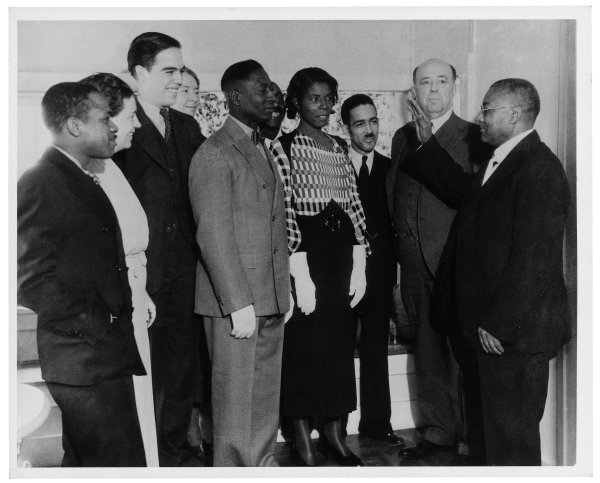 Black-and-white wedding photo of Huddie and Martha Ledbetter with other attendees.