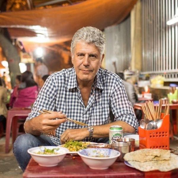 Anthony Bourdain eating a meal