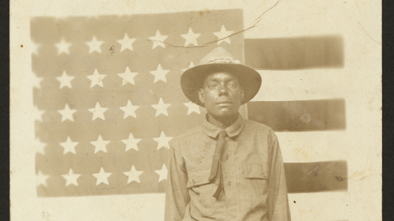 African-American soldier in front of an American flag, WWI