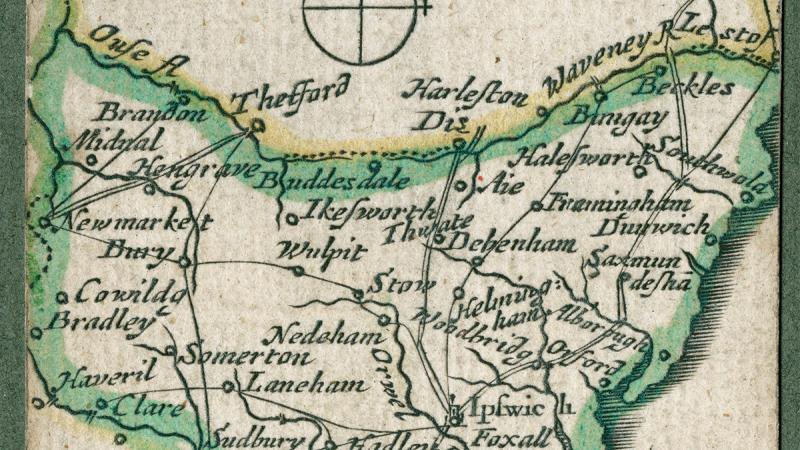 A color pocket map with mostly green outlines over yellowed paper showing the routes and dimensions of Suffolk, England.