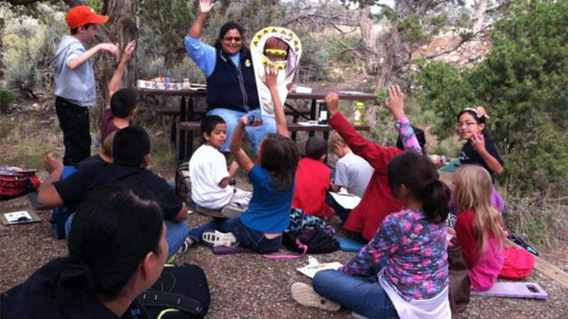 Students learning about Ute cultural artifacts.