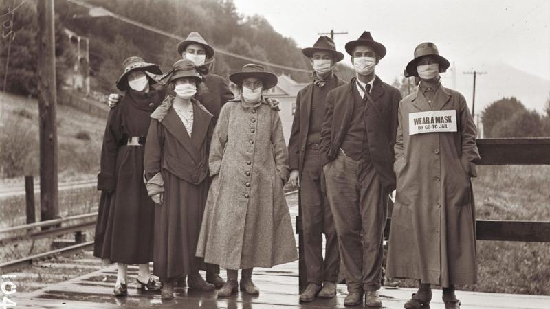 A vintage photo presumed to have been taken during the 1918 influenza pandemic, when face masks were as iconic as they are today.